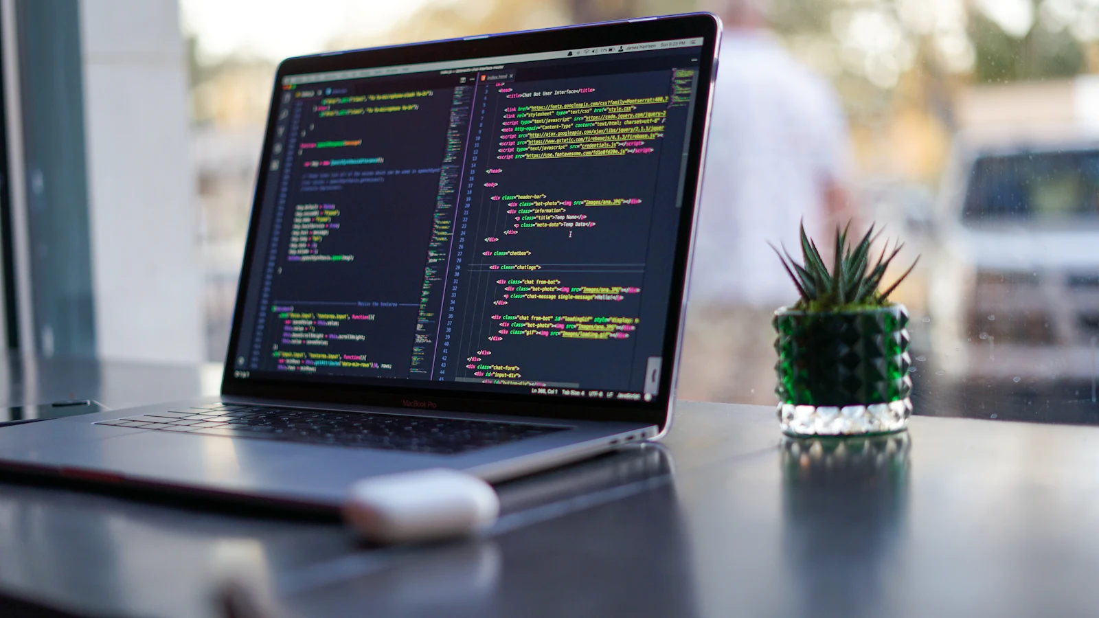 Open source WordPress plugins code on a laptop by a window