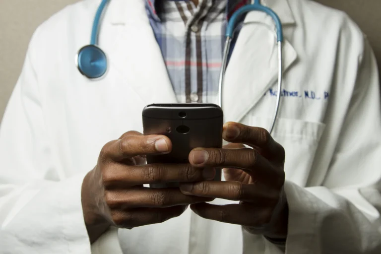 Doctor holding a smartphone