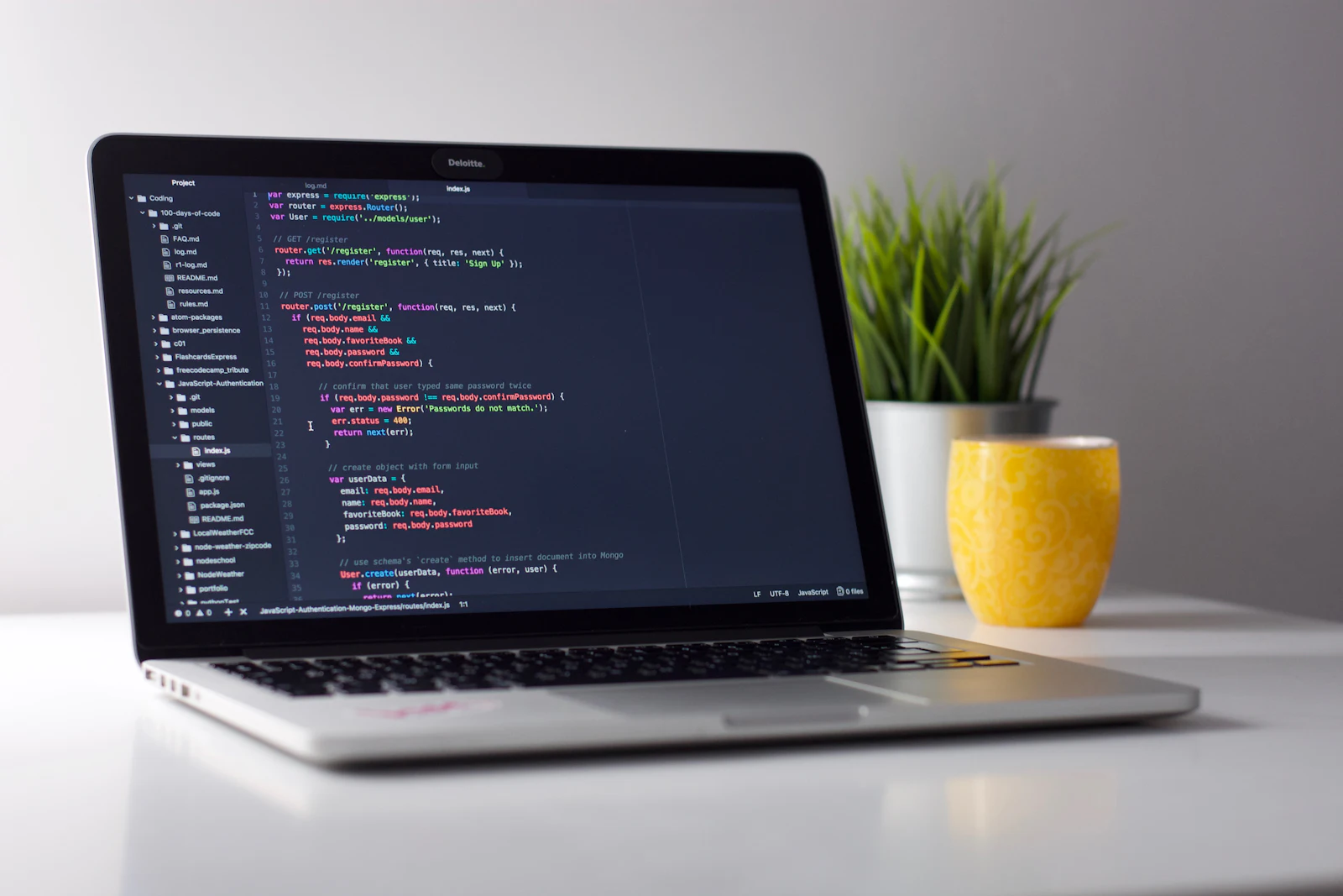 WordPress plugins developed by BongDevs on a laptop code editor